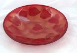Fused glass bowl, red with copper mica leaves